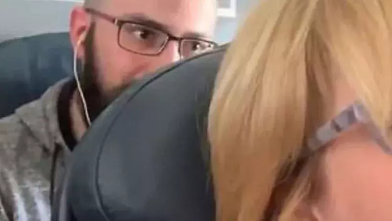 Footage Of American Airlines Passenger Shamed For Repeatedly Pushing Woman's Seat Is Going Viral