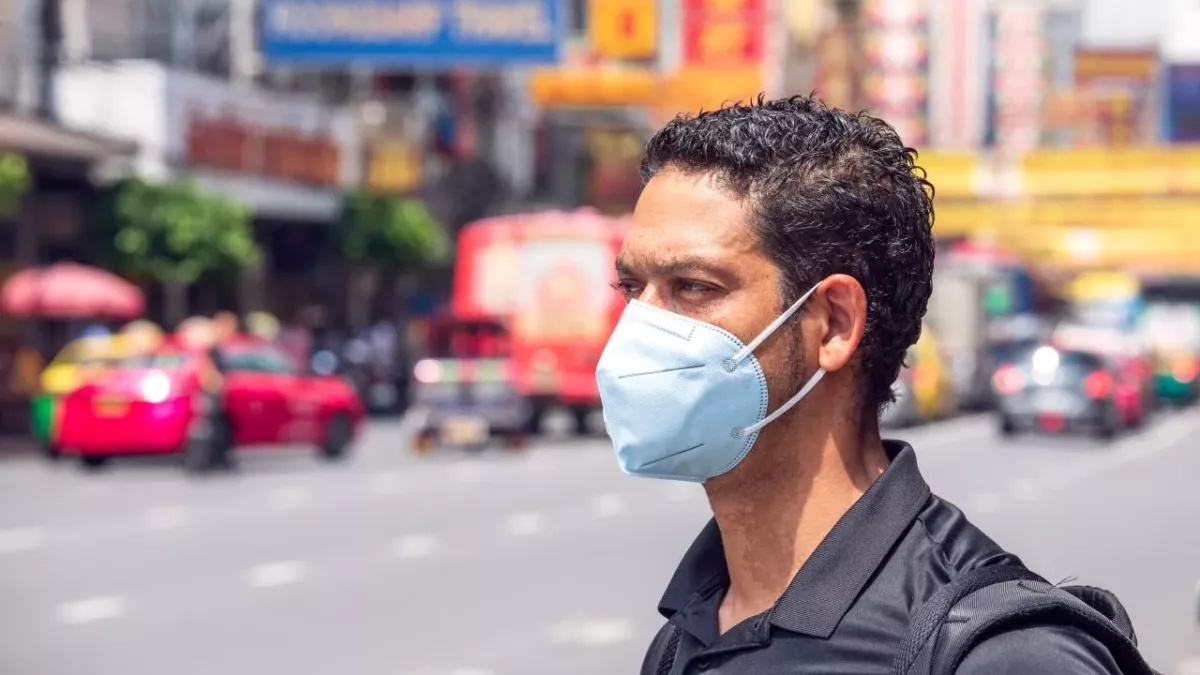 Masked man in big city