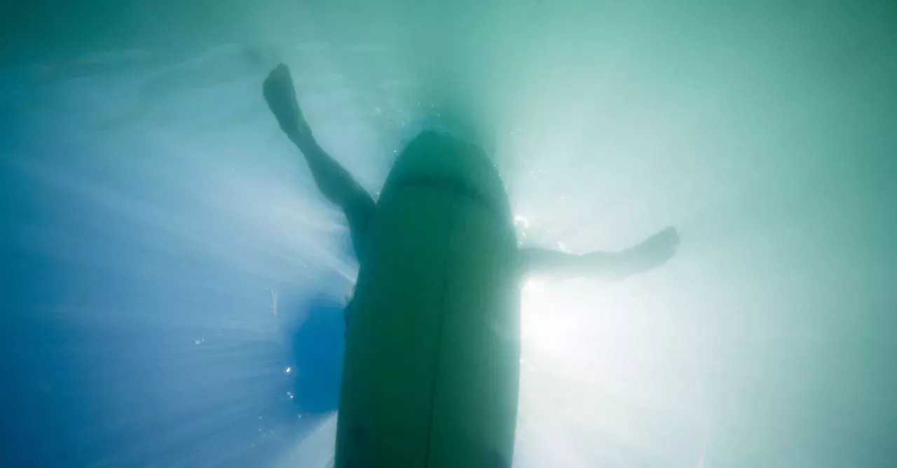 Surfer reveals horror injury after fist fight with great white shark