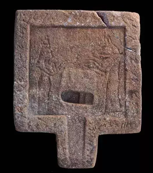 Offering table representing the jackal-headed god Anubis and the goddess Isis.