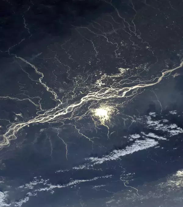 The sun reflected on the Brahmaputra river in India