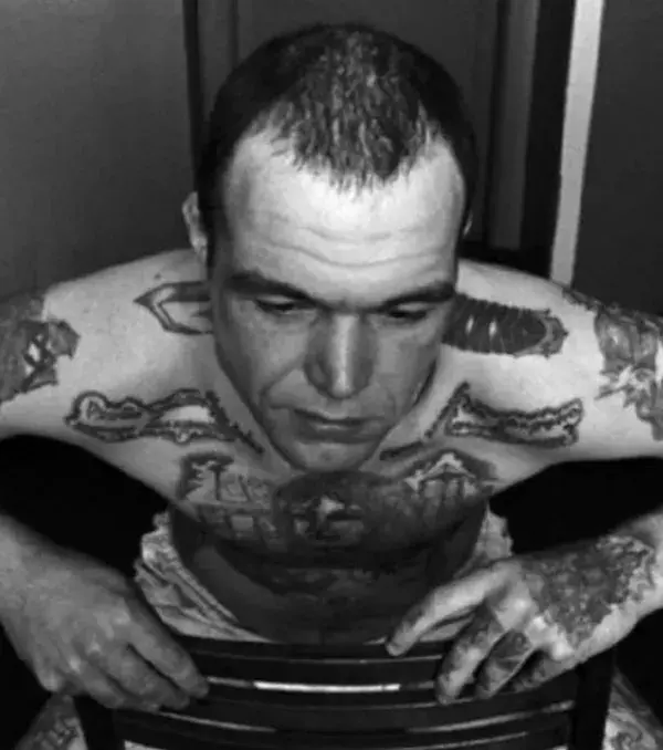 A dagger that crosses through the neck: this tattoo is typically found in Russian gangs and is used to show the bearer is not afraid to take a life and is ready and able to do so for whoever needs – for a price of course.