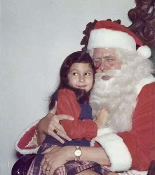 A little too much love from this Santa Claus