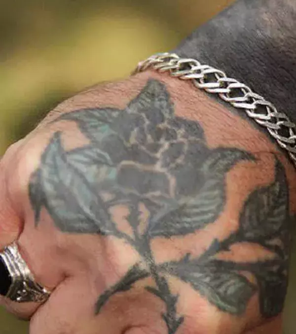 A rose with thorns: this tattoo means the person was imprisoned at 18 years of age. It’s also common among Russian and Asian gangs.